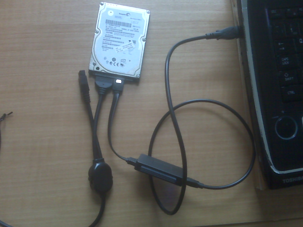 Laptop Hard Drive Connected to Laptop Using SATA to USB Adapter